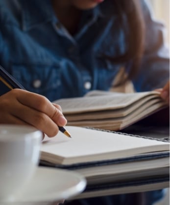 Young female student handwriting information