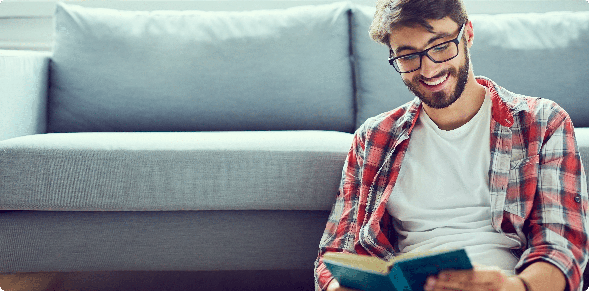 Consistent and Clear Book Interior Formatting, Man with book by a couch