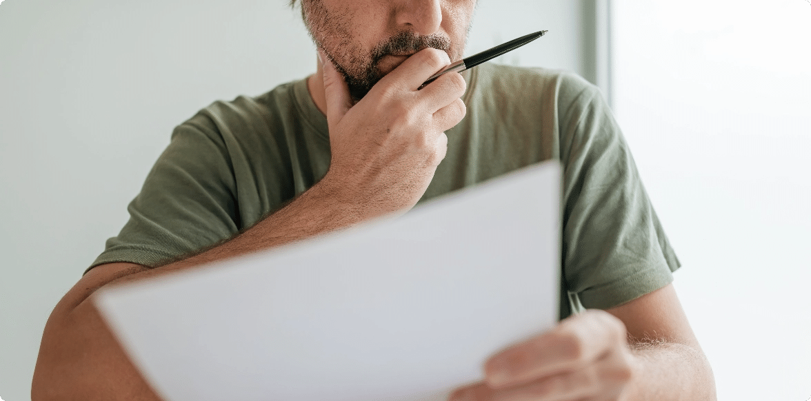 Frequently Asked Questions, Man with paper and a writing utensil in a hand