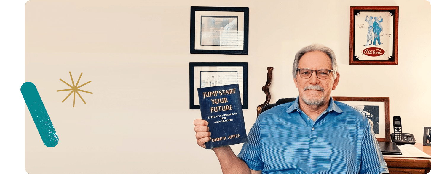 Older man holding a book